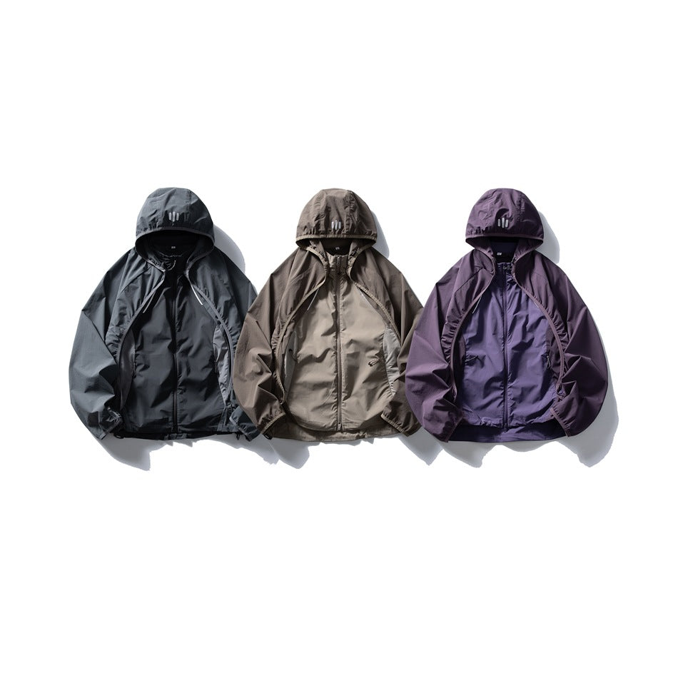 Three hooded zip jackets side by side in gray, taupe-brown and purple