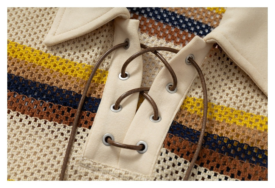 Close-up of brown cord lacing through metal eyelets on a cream placket, against striped open-knit fabric.