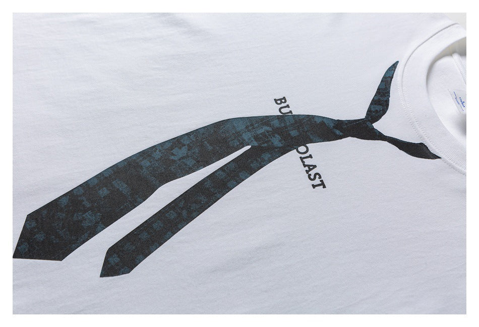 Partially cropped white T-shirt laid flat, showing a large dark abstract graphic and English lettering on the front.