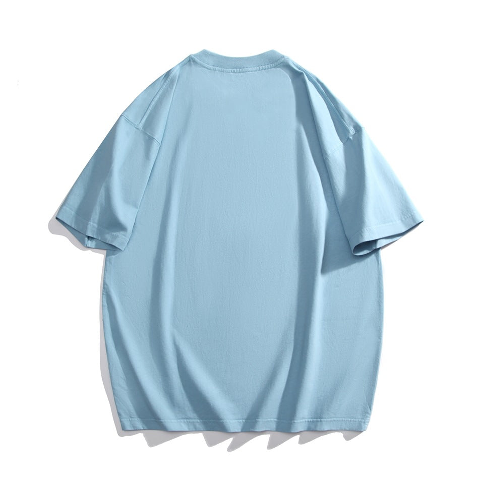 Back view of a plain oversized light blue T-shirt with short sleeves.