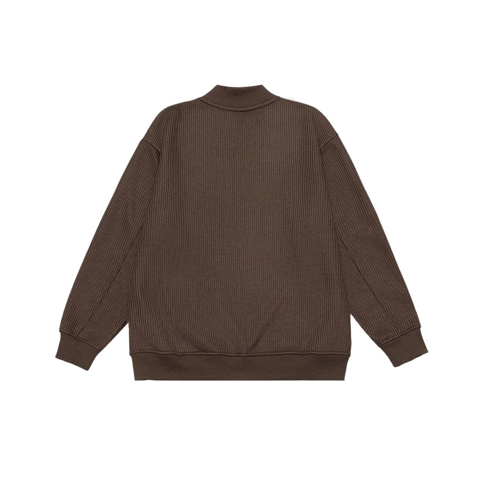 Back view of a brown textured knit pullover with a stand collar and ribbed cuffs and hem.