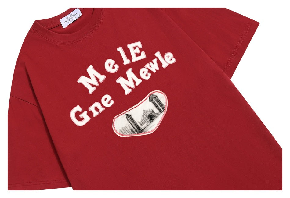 Flat-lay front view of a red short-sleeve crew-neck T-shirt with raised white lettering and a heart-shaped graphic.