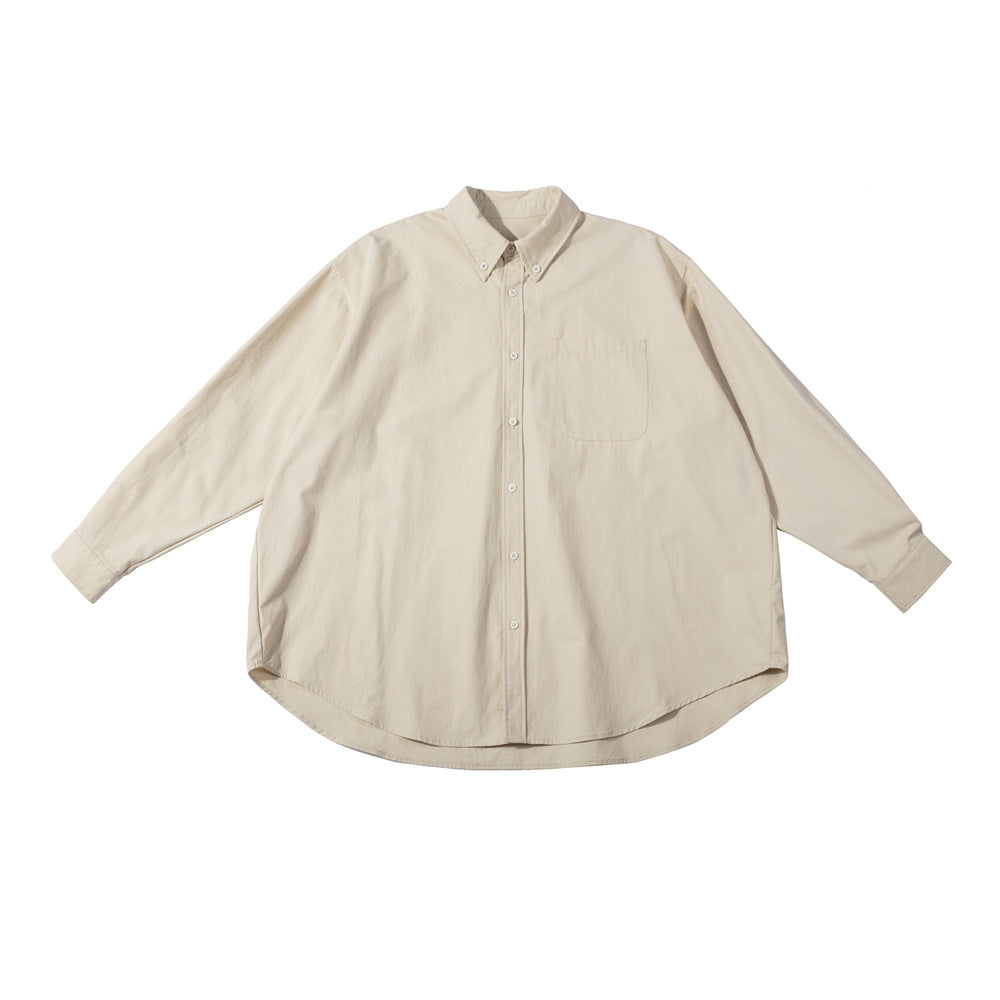 Cream apricot oversized long-sleeve button-down shirt with chest pocket, flat lay on white background