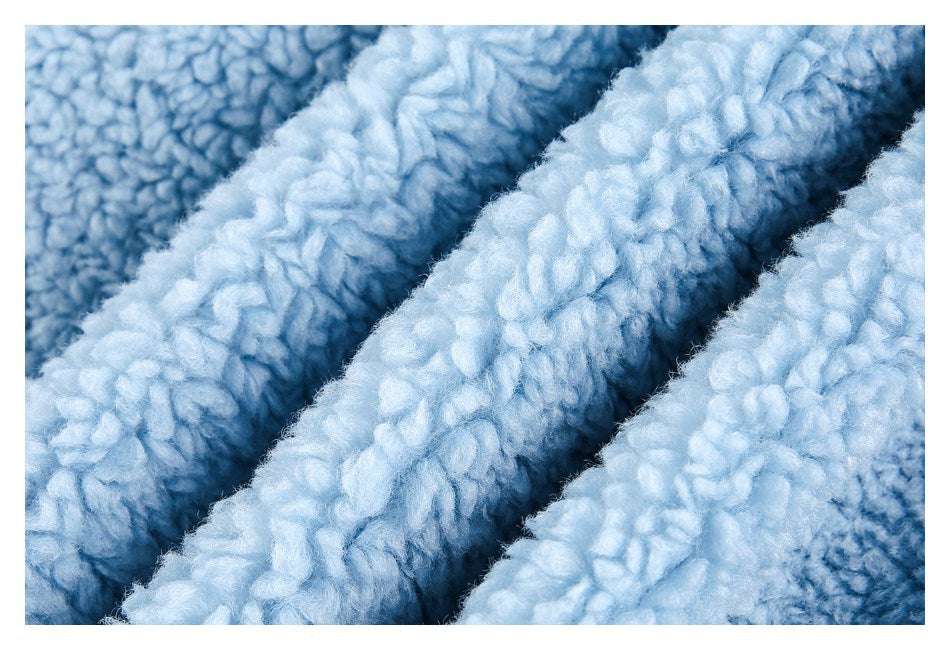 Extreme close-up showing the soft, textured pile of the light blue fabric.