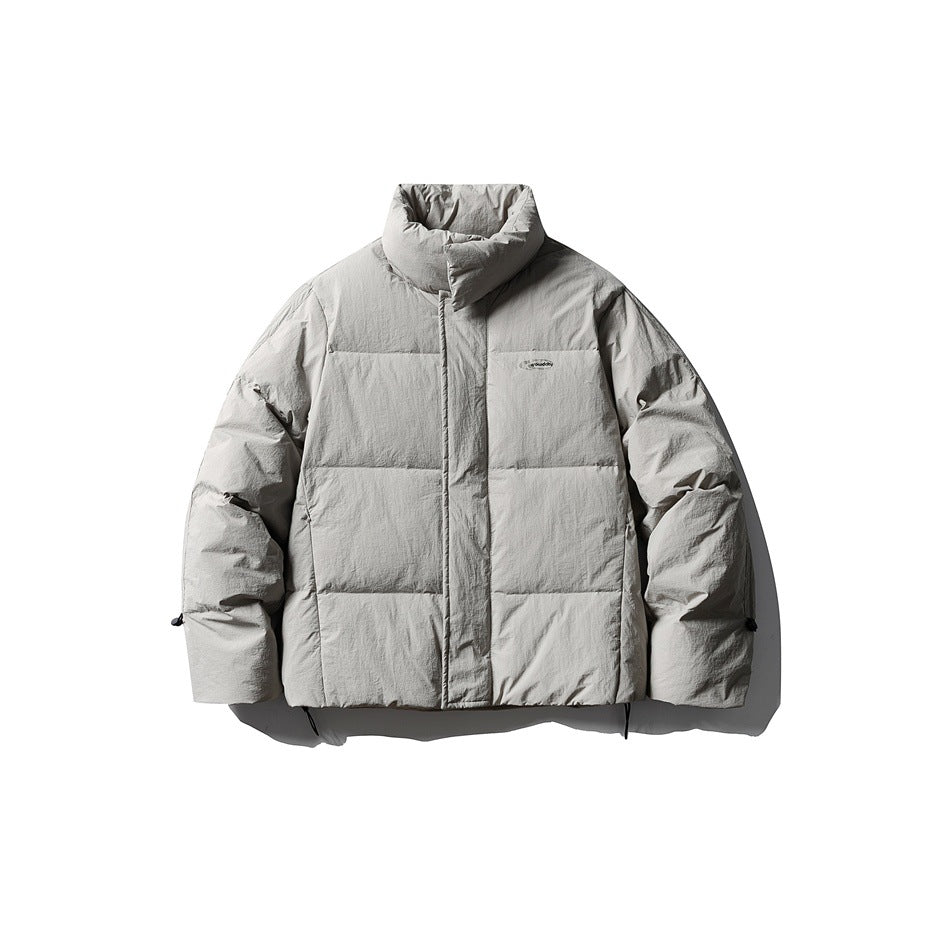 Light gray puffer jacket with stand collar, covered front closure and horizontal quilting, flat lay front view