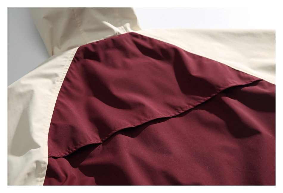 Close-up of the jacket's cream and burgundy back panels and overlapping seam.