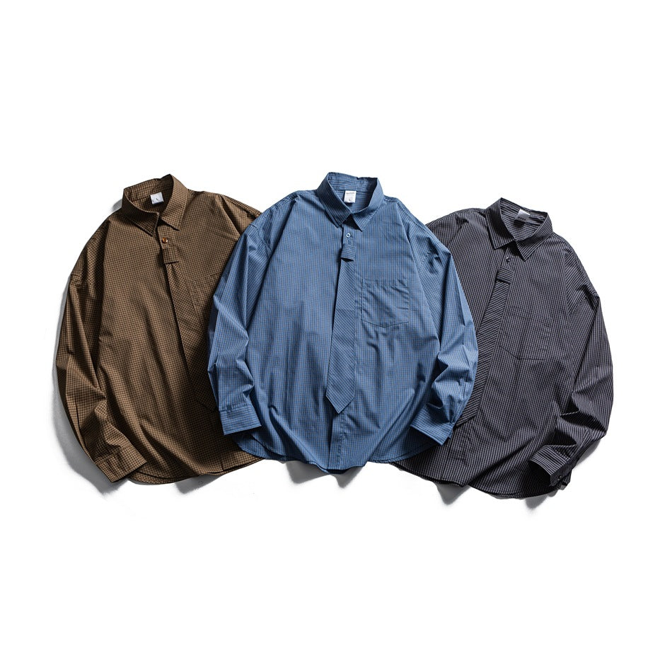 Three flat-lay long-sleeve plaid shirts in brown, blue, and dark charcoal, each with a pointed collar.