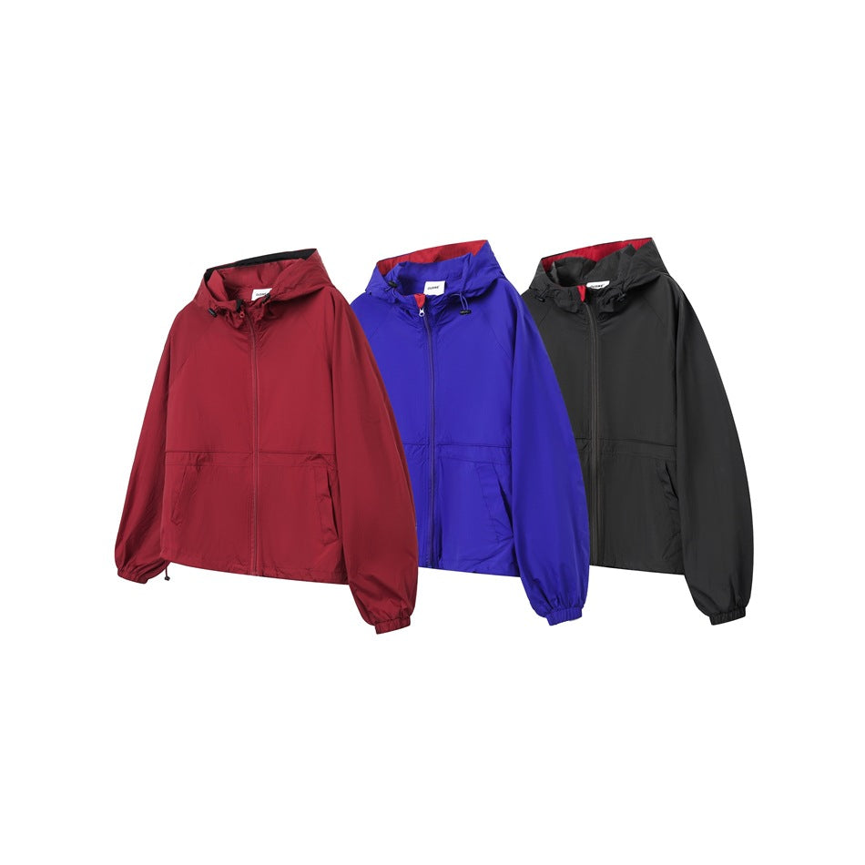 Three hooded zip-front jackets shown from the front in red, blue, and black.