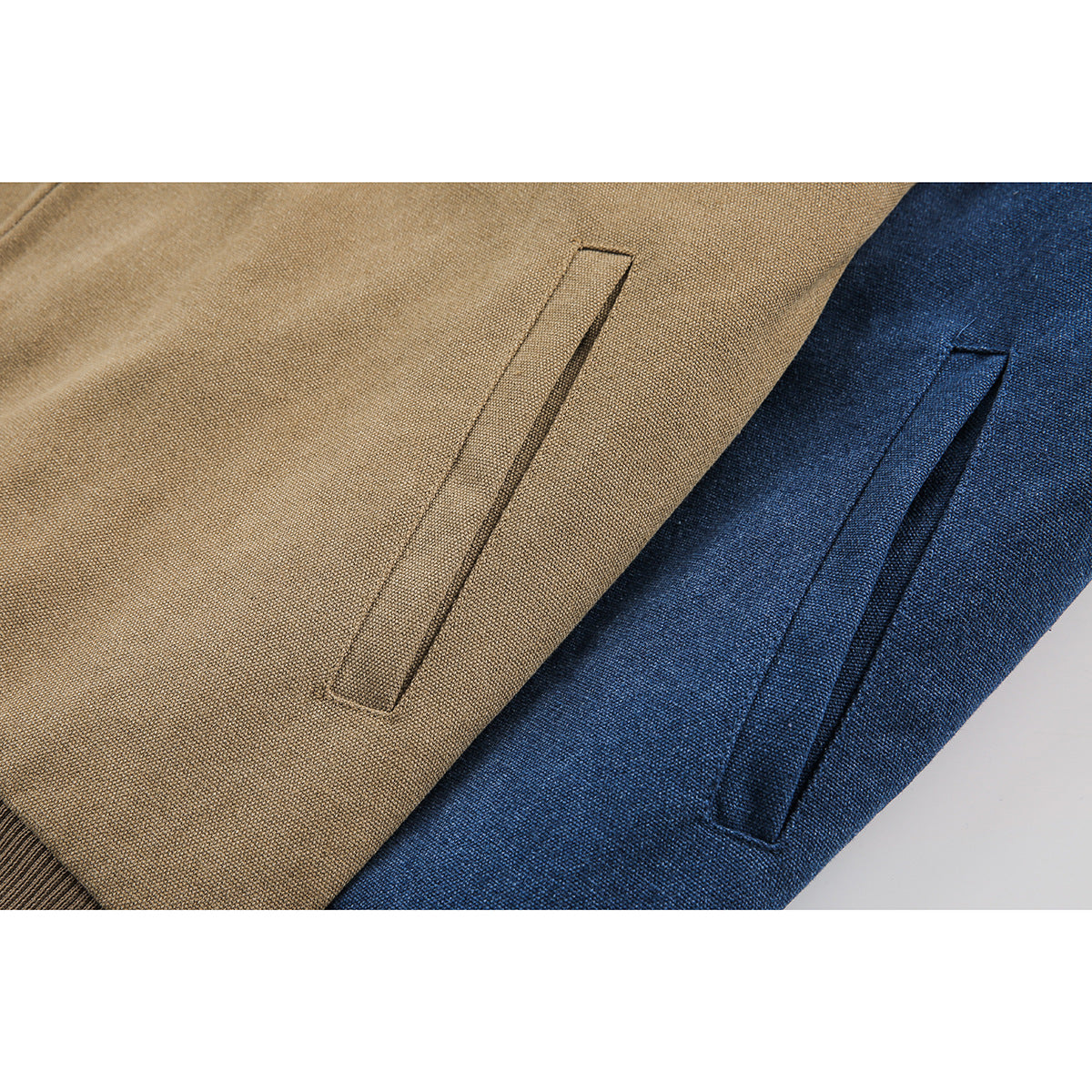 Close-up of slanted welt pockets on tan and blue jackets.