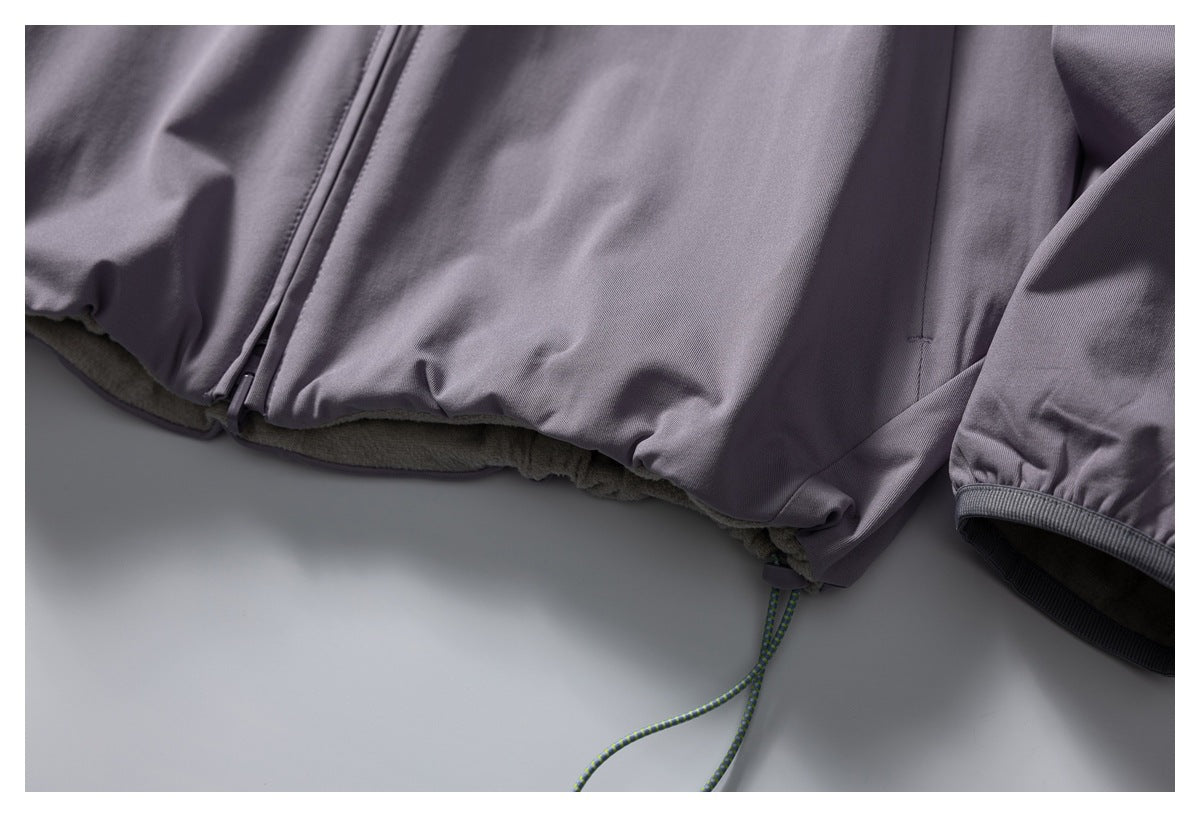Close-up of the purple jacket hem, showing its soft lining and adjustable drawcord.