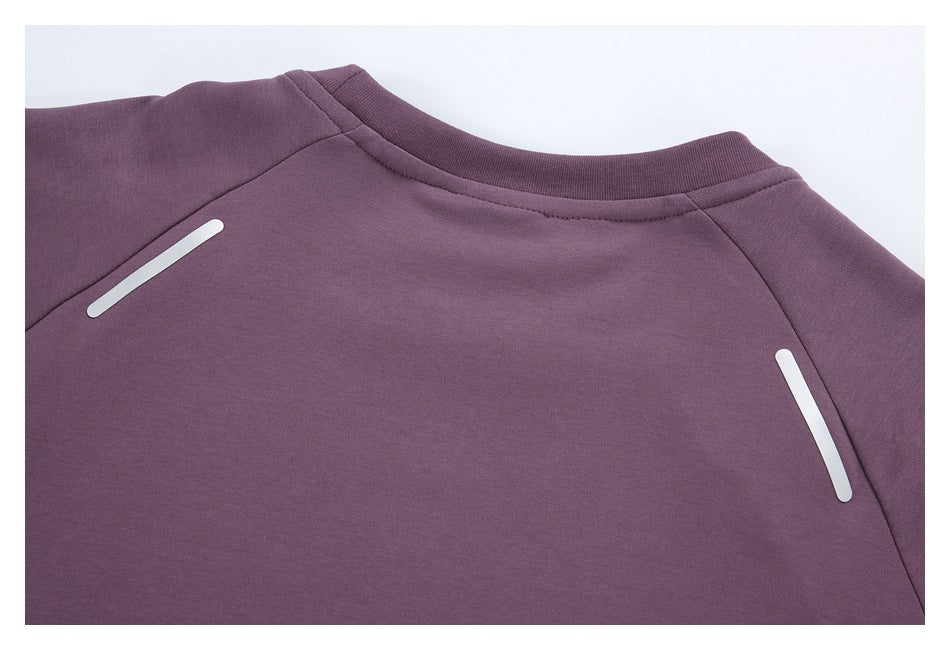 Close-up of the purple garment's back neckline and shoulder seams with white reflective strips.