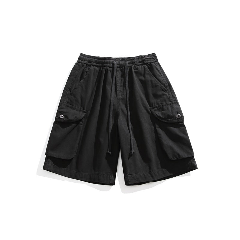 Black cargo shorts flat lay with drawstring waistband and large flap side pockets
