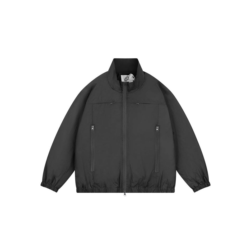 Black stand-collar zip jacket with matching zipper, zippered pockets and elastic cuffs and hem, flat front view