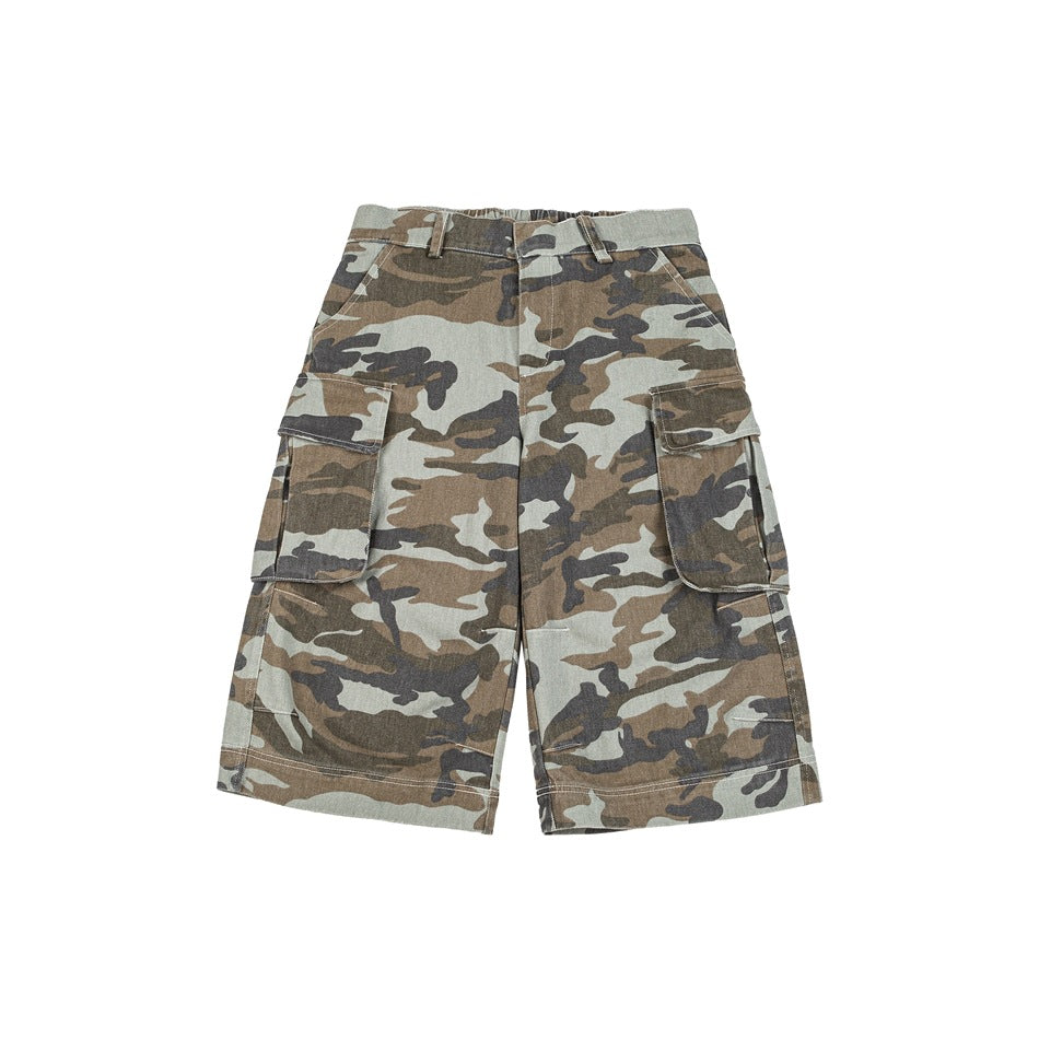 Front of camouflage cargo shorts with flap side pockets, belt loops and a wide knee-length leg on a white background