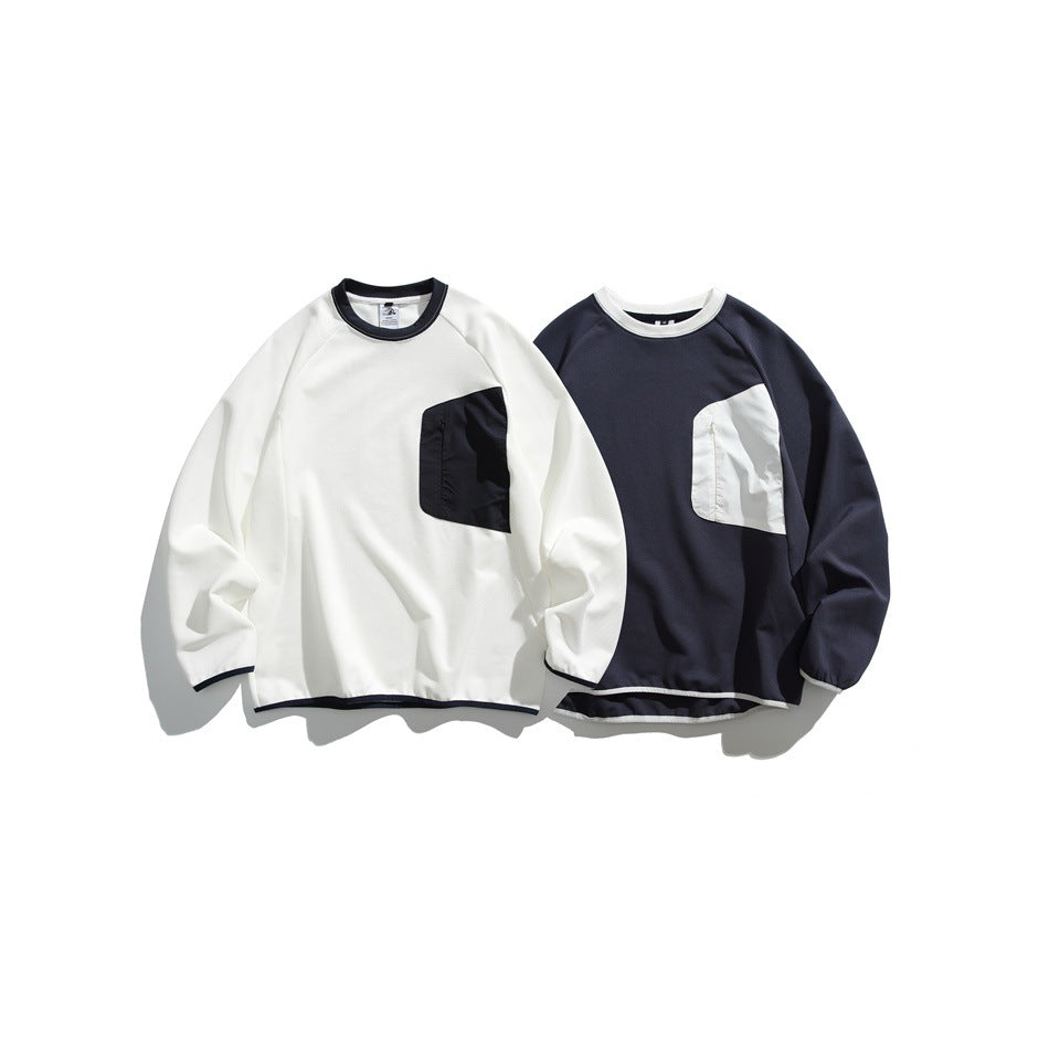 Two long-sleeve crewneck sweatshirts laid flat: one off-white with a navy pocket, the other navy with an off-white pocket.