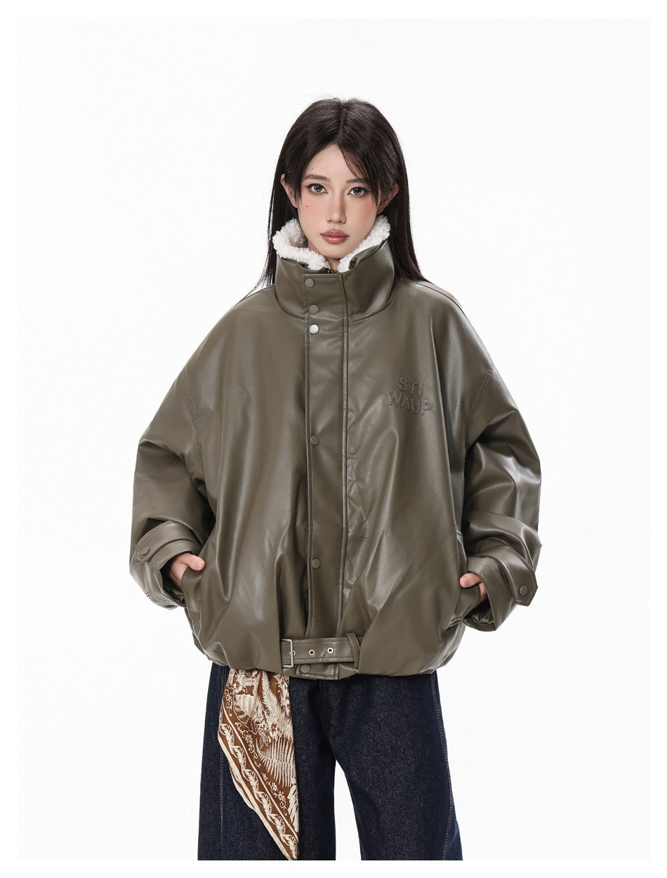 Front view of a model in an oversized olive-gray jacket with a white fleece-lined high collar and waist belt.