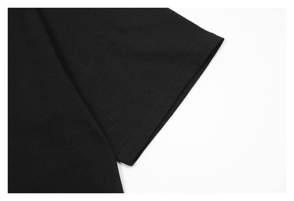Close-up of the black T-shirt’s short sleeve and stitched cuff.