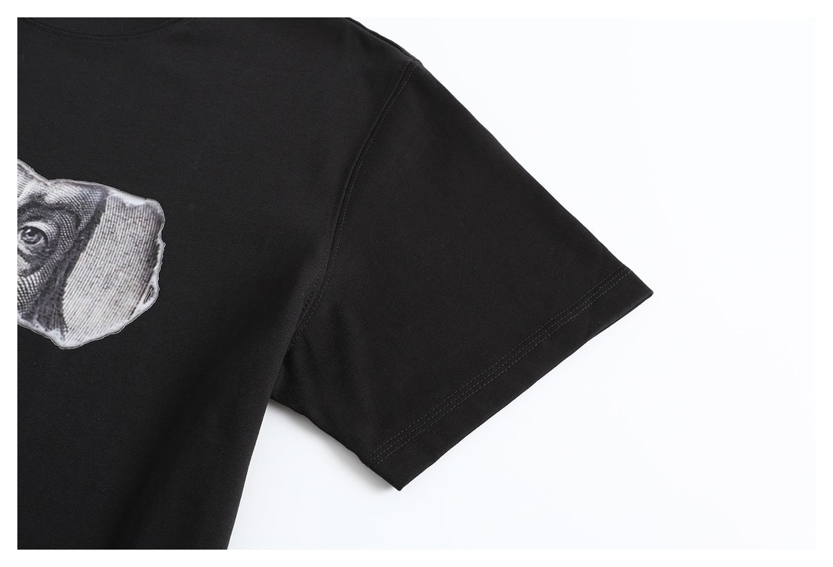 Close-up of a black T-shirt sleeve with double-stitched hem and part of the chest graphic.