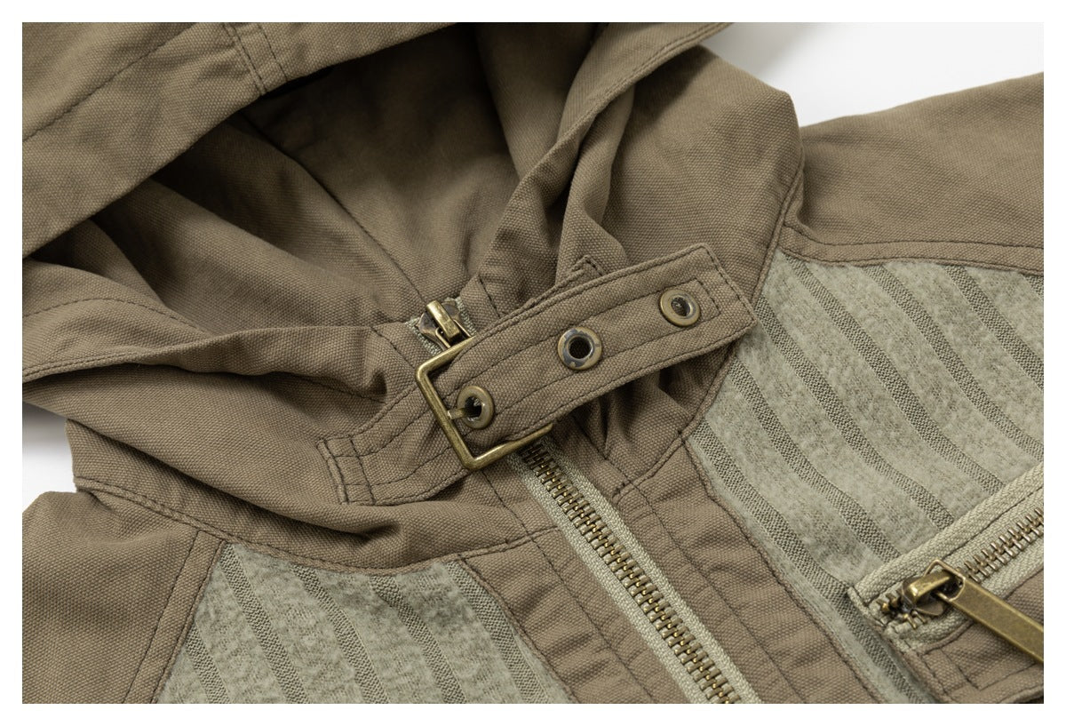Close-up of the taupe jacket hood and buckle-and-eyelet fastening beside the front zipper.