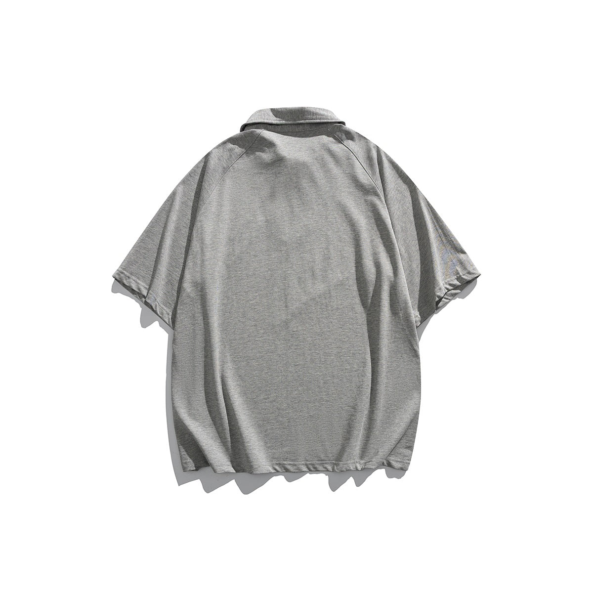 Back view of a plain heather-gray short-sleeve collared top with raglan seams.