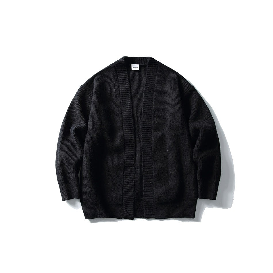 Black ribbed-knit open-front cardigan with wide ribbed front bands, shown flat from the front