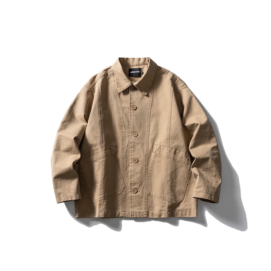 Khaki button-front work jacket with pointed collar, paneled seams and two large patch pockets, flat lay front view