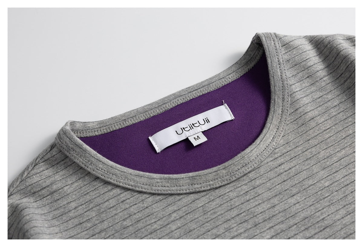 Close-up of the gray striped top’s neckline, purple inner panel, and sewn-in size M label.