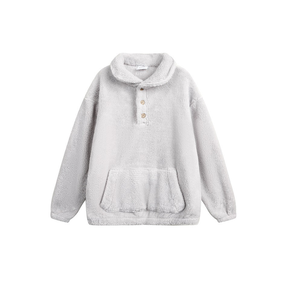Light gray plush fleece-like pullover with collar, three buttons and front pocket, flat lay