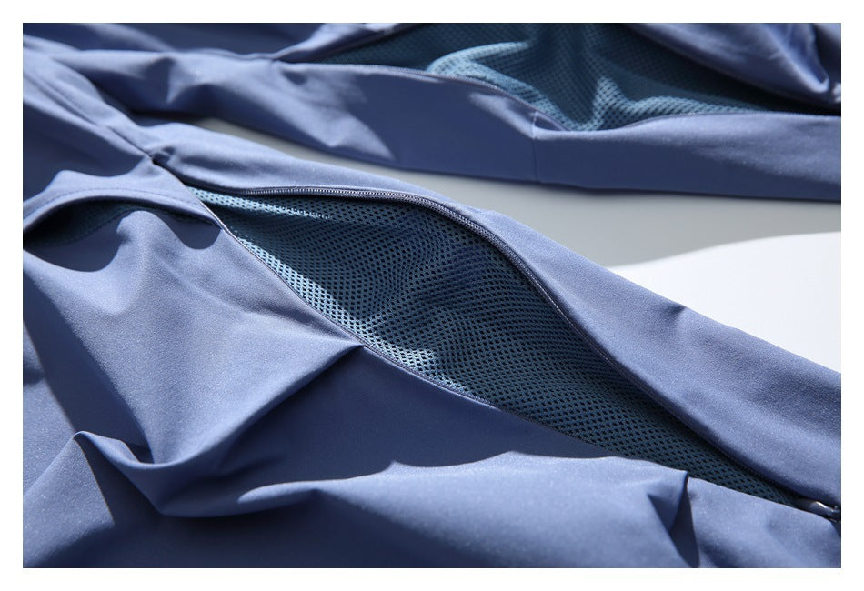 Close-up of a blue garment's zippered mesh ventilation panel.