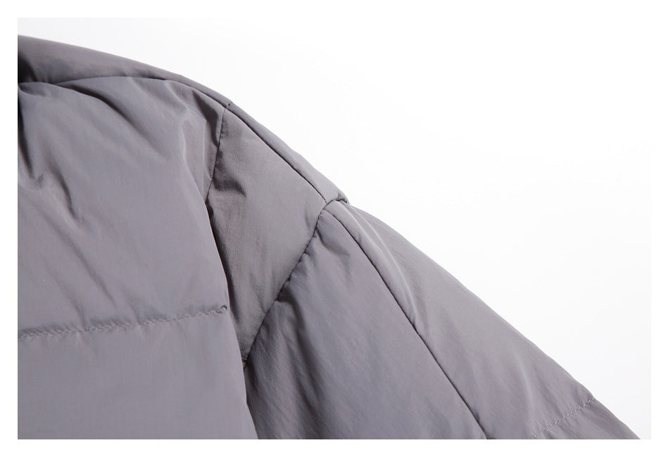 Close-up of the gray jacket's shoulder seam and sleeve quilting.