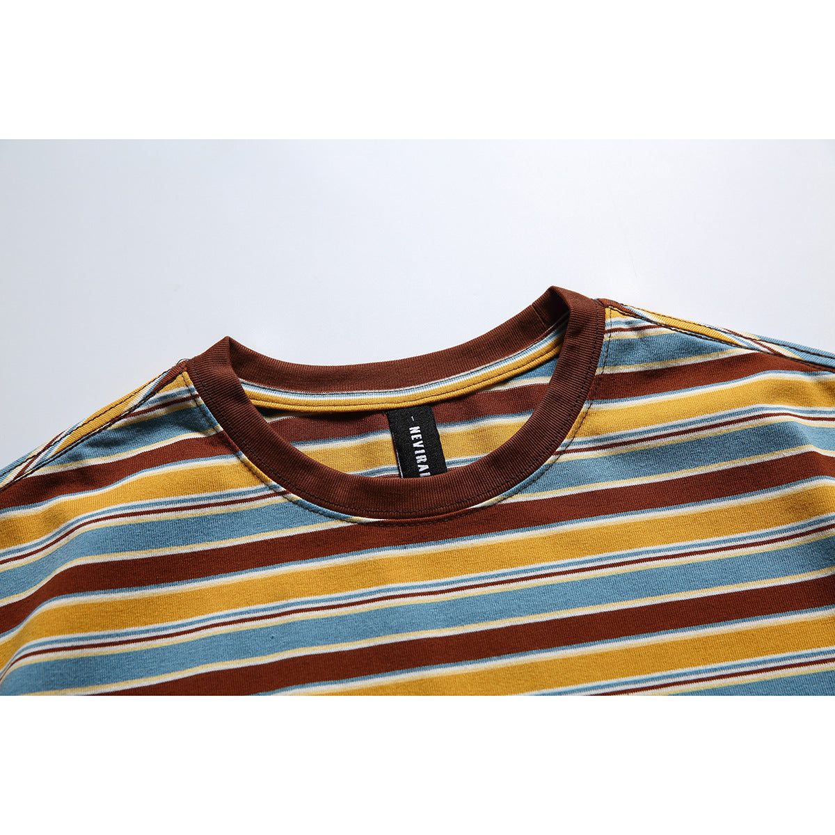 Close-up of a striped T-shirt’s brown ribbed crew neck and sewn black neck label.