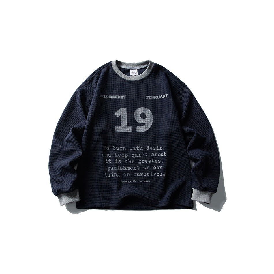 Navy waffle-knit crew neck sweatshirt with gray collar and cuffs and a large 19 date print with quote