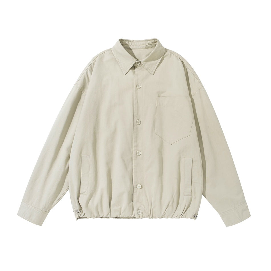 Light khaki button-front shirt-style jacket flat lay with chest pocket, slit pockets and drawstring hem