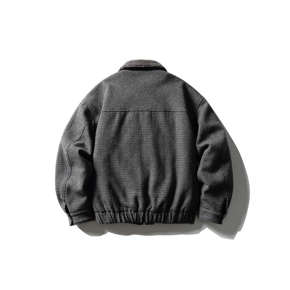 Back view of dark gray houndstooth jacket with yoke seam, fleece-like collar and elastic ribbed hem
