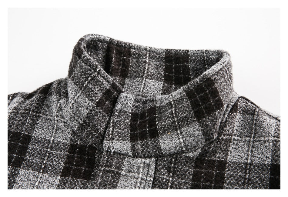 Close-up of the jacket's folded high collar and black, gray, and white plaid pattern.