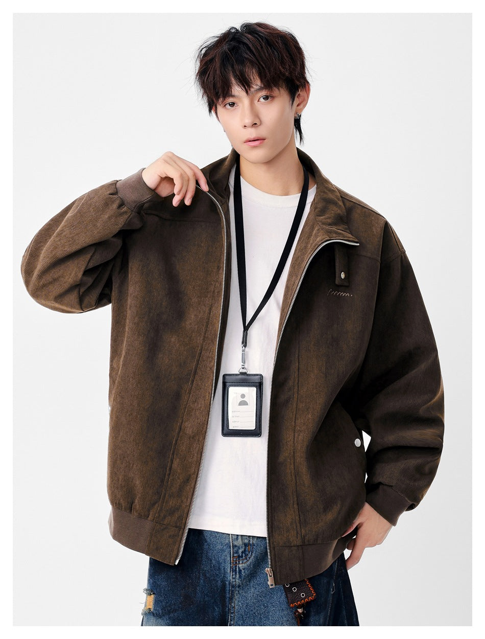 Model wearing an open dark brown zip-front jacket with ribbed cuffs and hem and a small chest detail.
