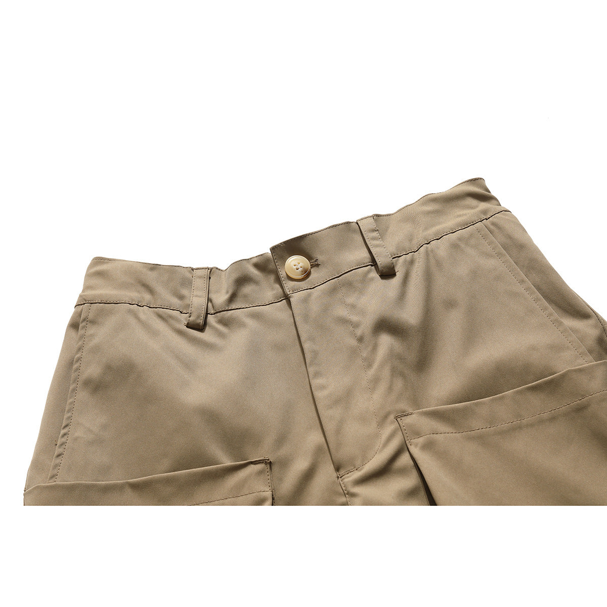 Close-up of tan cargo pants showing the buttoned waistband, belt loops, fly, and top edges of the cargo pockets.