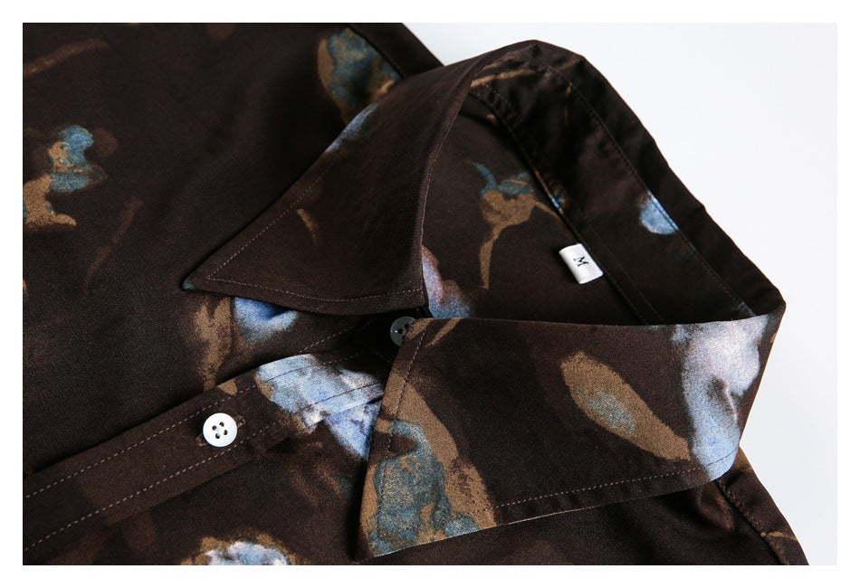 Close-up of the shirt's pointed collar, floral print, buttons, and small size M label.