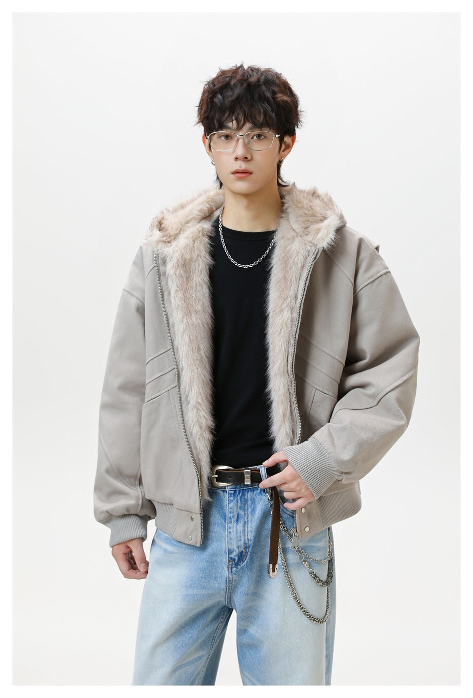 Model wearing an open light gray hooded jacket with plush lining, diagonal stitched panels, and ribbed cuffs and hem.