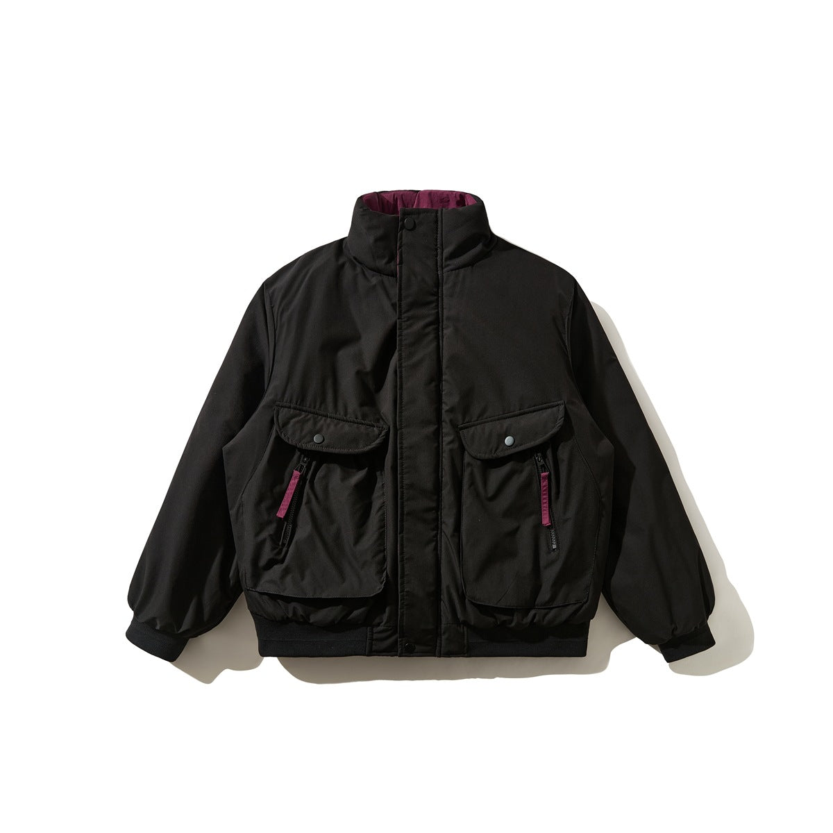 Black padded stand-collar jacket flat lay with large flap pockets, ribbed hem and burgundy zipper pulls
