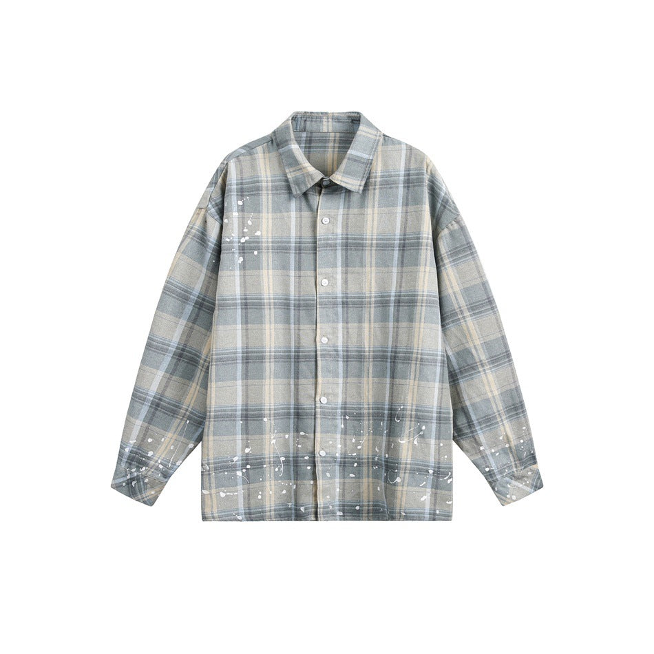 Blue-gray and beige plaid long-sleeve button-up shirt with white paint splatters, flat lay front view