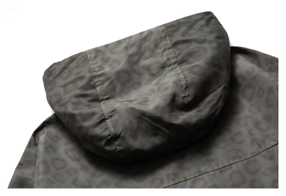 Close-up of the jacket's charcoal leopard-print hood and stitched seams.
