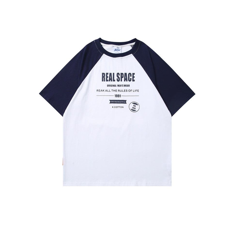 White T-shirt with navy raglan short sleeves and collar, front view with navy REAL SPACE text graphic