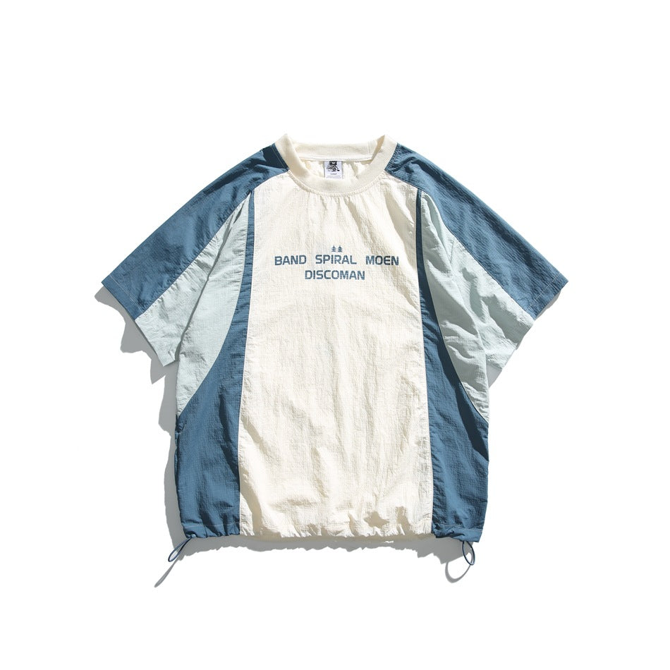 Blue and cream color-block short-sleeve tee with chest print and drawstring hem, flat lay front view