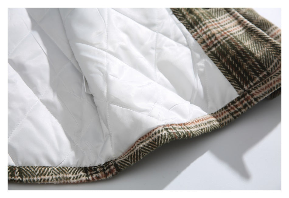 Close-up of white quilted lining and the plaid garment hem.