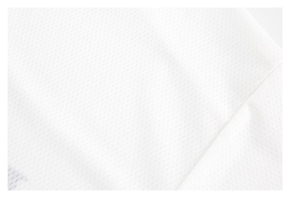Close-up of white mesh fabric showing its small repeating texture.
