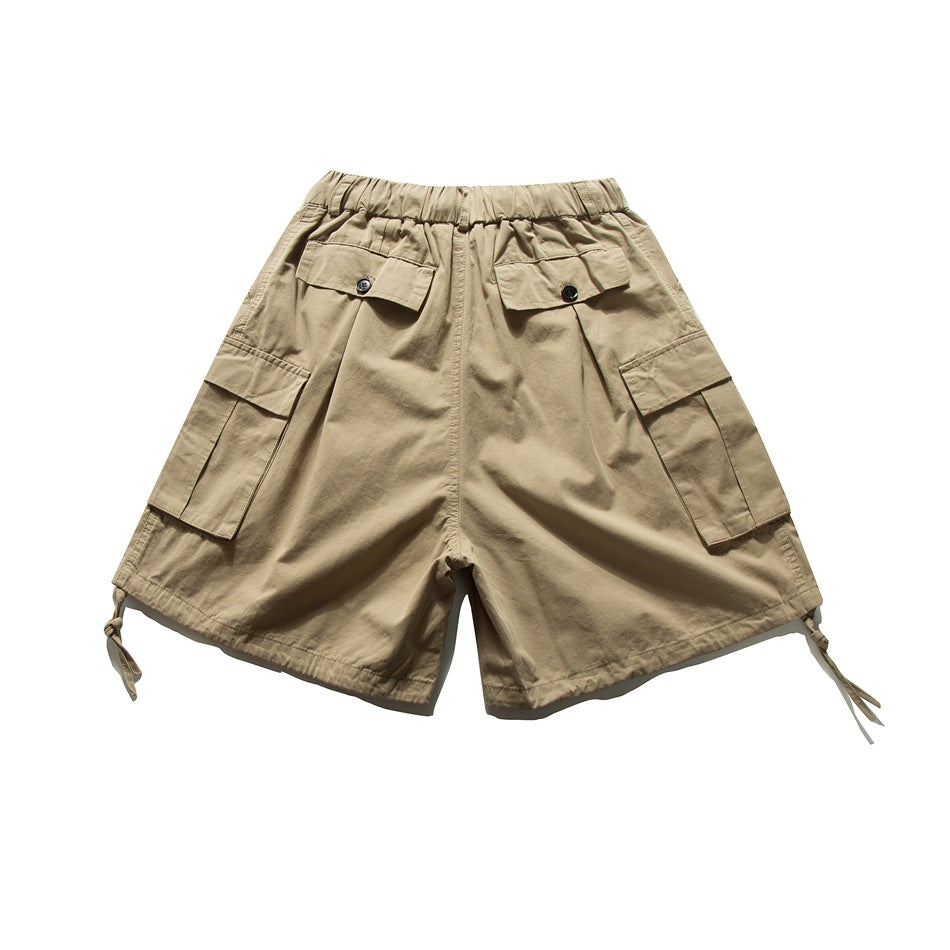 Back view of khaki cargo shorts with button flap back pockets, side cargo pockets and hem drawcord ties