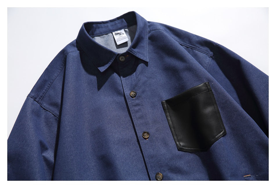 Close-up of the blue overshirt's front, showing its buttons, collar, and black chest pocket.