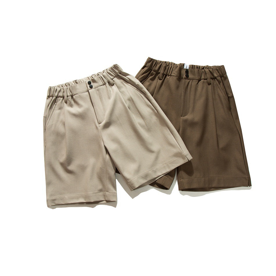 Front view of beige and dark brown knee-length shorts with gathered waistbands, belt loops, and front pockets.
