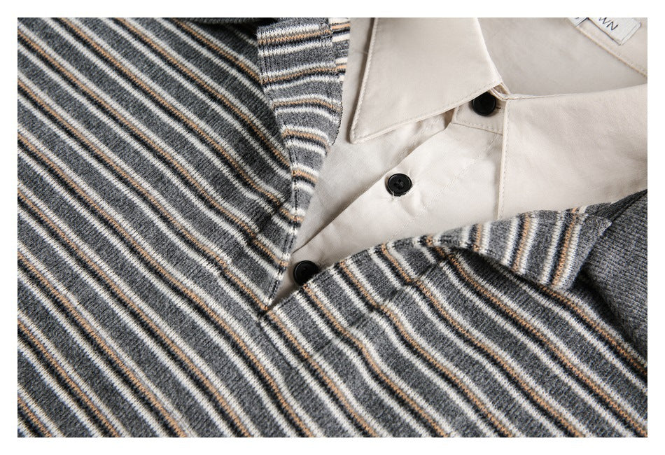 Close-up of the striped knit polo placket, cream collar and black buttons.